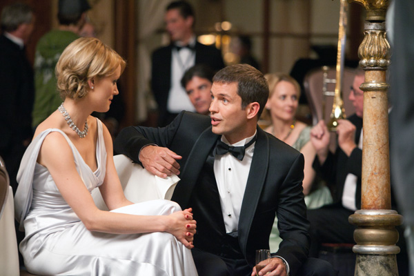 Photo of Taylor Schilling as Dagny Taggart and Matthew Marsden as James Taggart