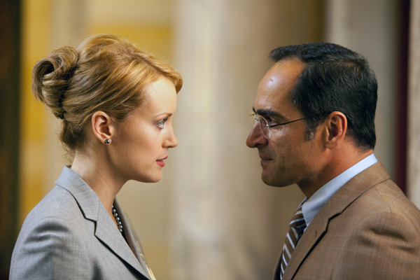 Photo of Taylor Schilling as Dagny Taggart and Navid Negahban as Dr. Robert Stadler