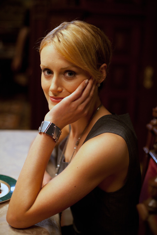 Photo of Taylor Schilling, playing Dagny Taggart, wearing the Rearden Metal bracelet