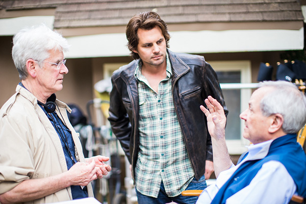 Photo of David Kelley, Kris Polaha, and John Aglialoro on the set of "Atlas Shrugged: Who is John Galt?"