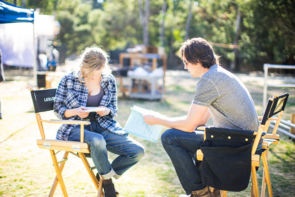 Photo of Laura Regan and Kris Polaha reading lines